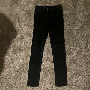 High waisted skinny jeans. Dark blue wash.